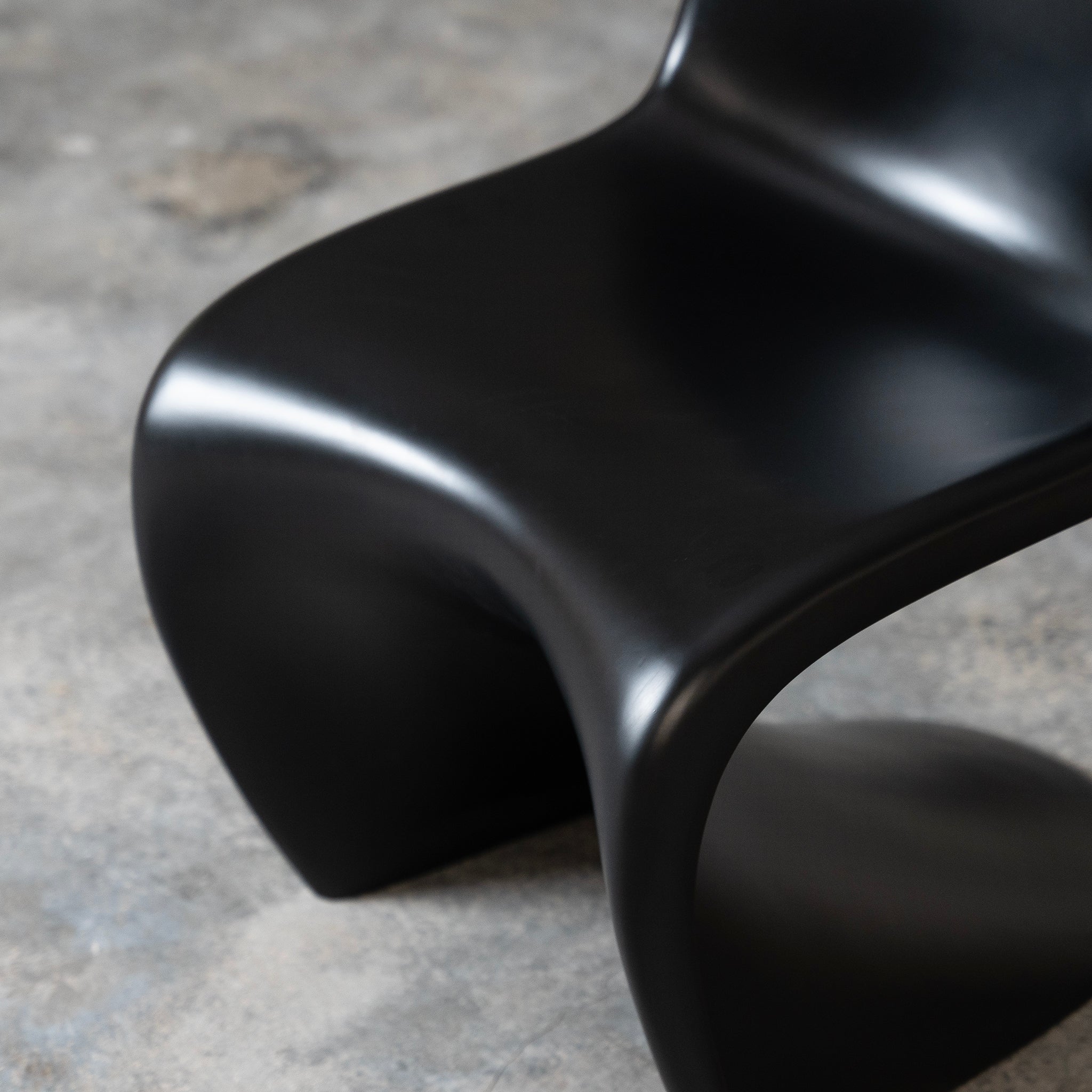 Black S-Shaped Plastic Chair