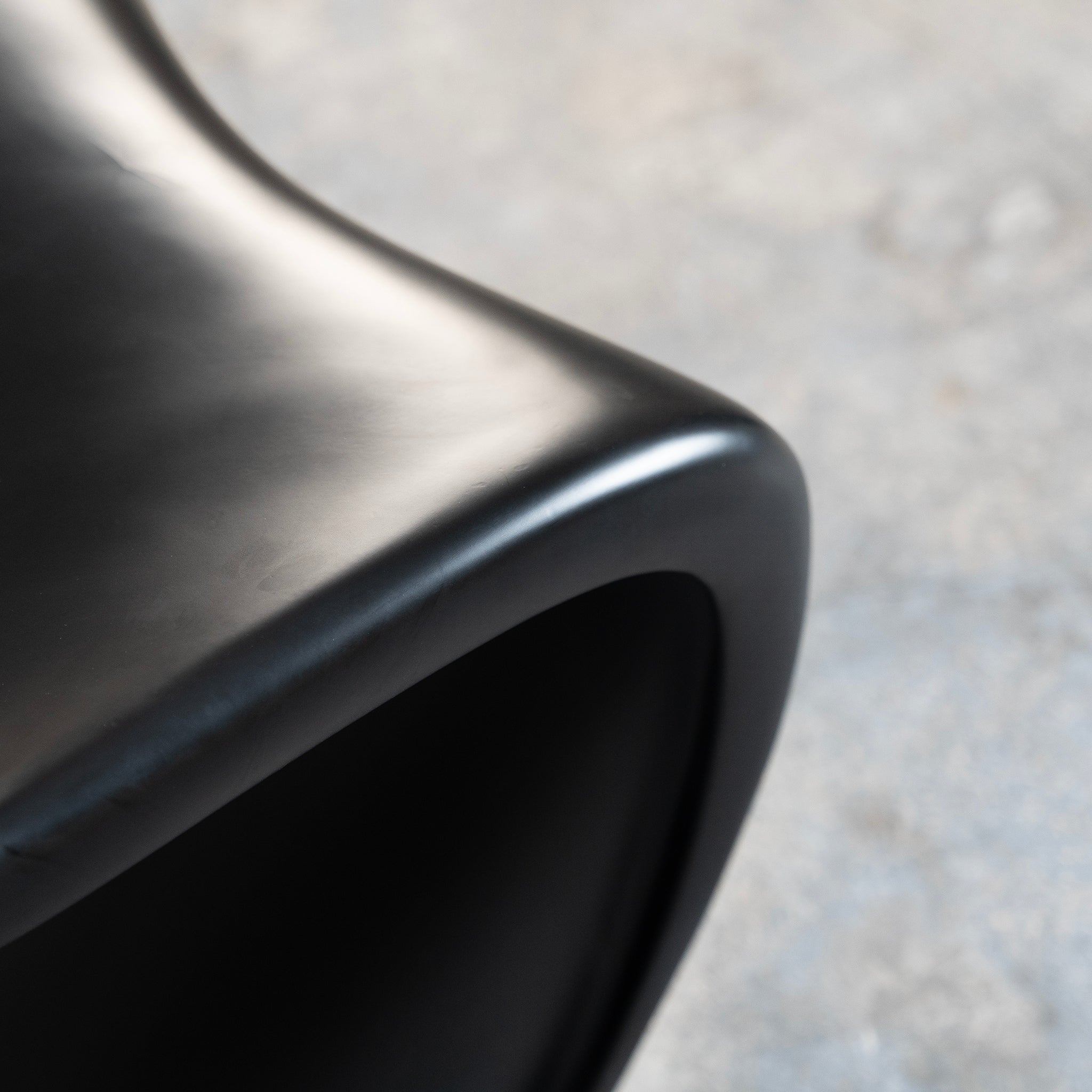 Black S-Shaped Plastic Chair